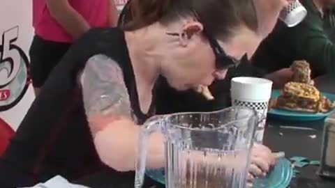 This eating contest newcomer absolutely DESTROYED her massive burger