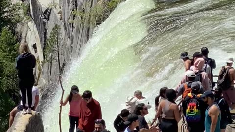 Yosemite Tourists Stand Near Waterfall Edge