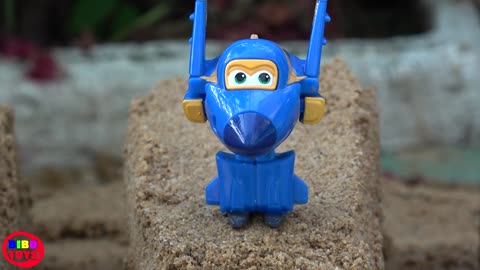 Super Wings Toys on the Sand with Water
