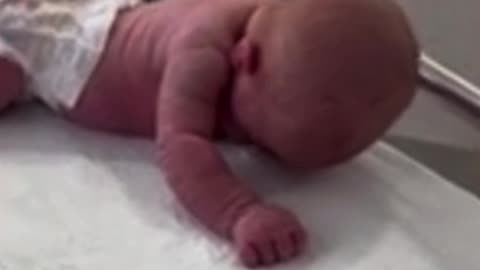 Mum is stunned when her three-day-old newborn lifts her head and begins to crawl just like a bub months older: 'Is this normal?'