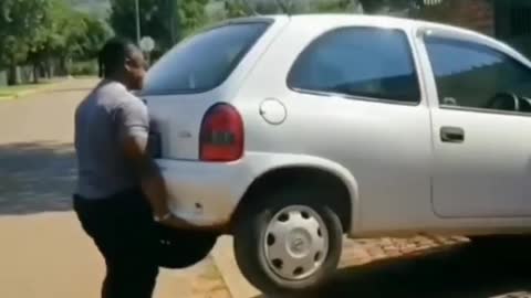 amazing, man lifts car..