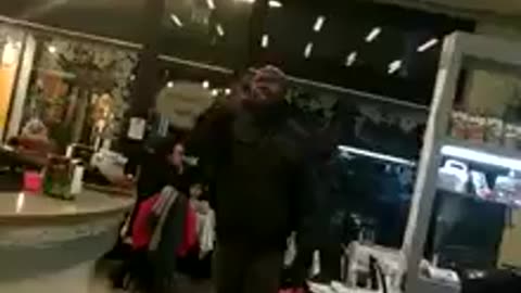A non-EU citizen insults everyone and destroys a bar because he expects to eat for free.