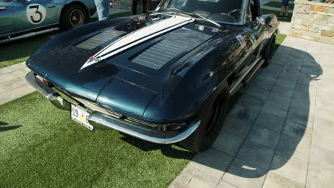 A Vintage Sports Car In Display In A Car Show