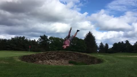 Guy Trying To Do Flips In A Sandpit At Golf Course Gets His Face Planted