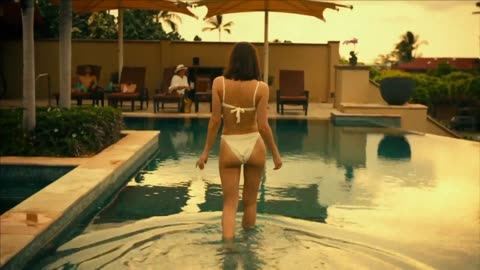 Alexandra Daddario in white bikini opening her clothes