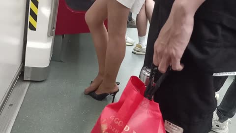 Slingback heels + tan nylon dipping in subway...