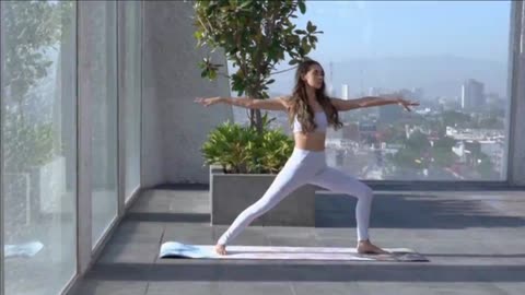 A Woman Standing while Doing Yoga