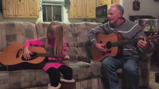 Brooke & Joe play guitar