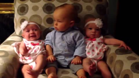 Adorably confused baby meets twins