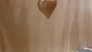 Carving a wooden heart keychain