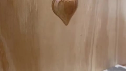Carving a wooden heart keychain