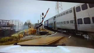 Police video captures near-miss after gate fails at train crossing