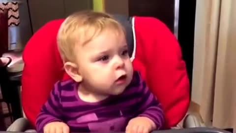Baby totally fascinated by Prince's 'Purple Rain'