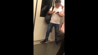Commuter Nabs Train Rat Under Shoe, Continues On Phone