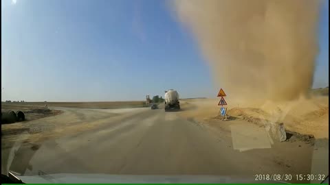 The car got into a dusty whirlwind in the way