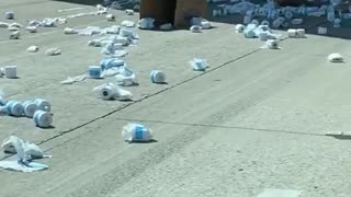 Truck Drops Multiple Boxes of Toilet Paper on Freeway