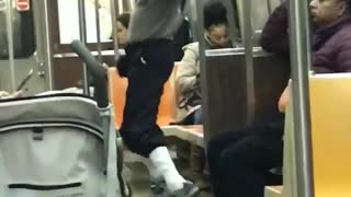 Man sunglasses grey sweater workout jump dance subway train