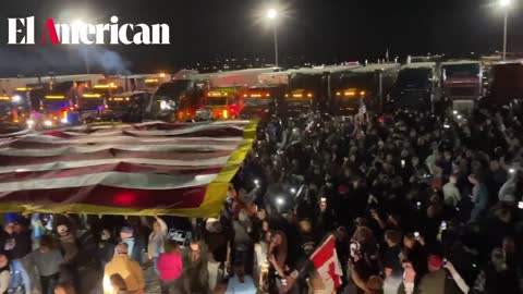 "People's Convoy" -Thousands in attendance as people wave 50x150ft. American Flag in Indianapolis, IN.