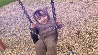 Cute Baby Enjoying the Swing