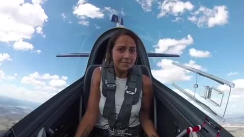 Female pilot flies a totally flat spin in the Extra 330LX stunt plane.