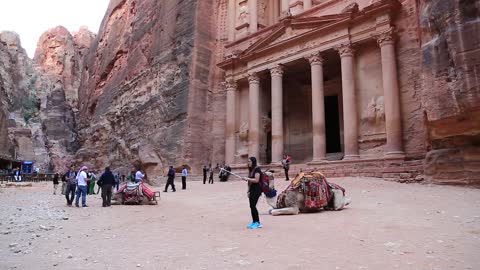 People and camels near Al Khazneh or the Treasury at Petra