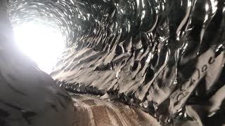 Exploring a Beautiful Naturally Crafted Ice Tunnel