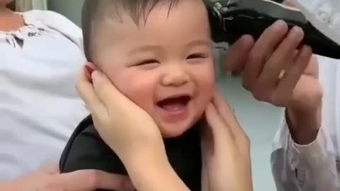Adorable baby laughing hysterically to his haircut!!