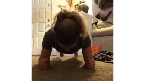 Dog refuses to let owner workout, wants to play instead