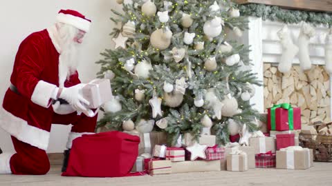 santa claus arranging gift boxes