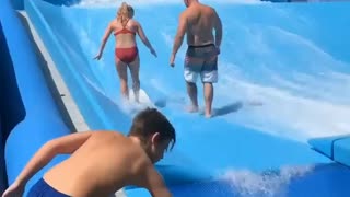 Guy Loses Balance on Wave Machine