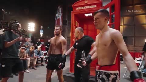 Russian Fighter Gets Lit Up With A Mean Combo During A Boxing Match Inside A Phone Booth