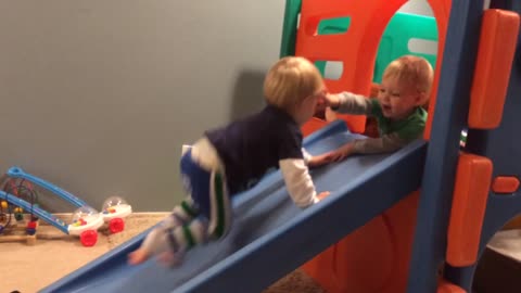 Toddler denies twin brother playpen access