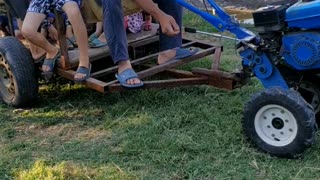 drove the children on a walk-behind tractor