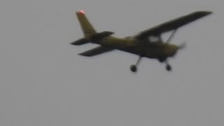 Zooming In On A Little Plane Circling Overhead