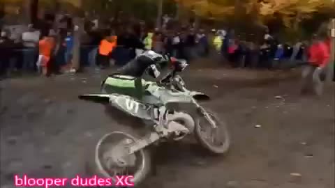 Spectators jumps over a crashed motobike to continue his call