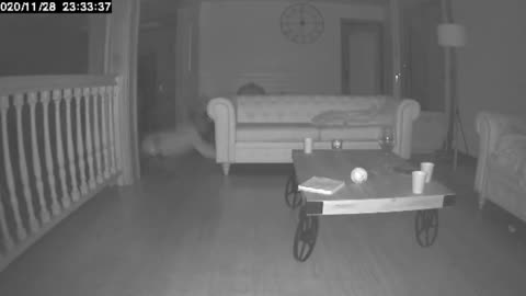 Surveillance Camera Records A Man Falling Down When He Walks Around The House At Night