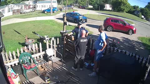 Michigan State police officer stands by . While women yells for help