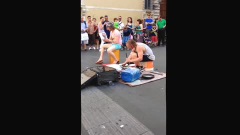 Street artist playing 'drums'