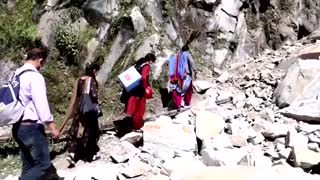 Indian medics scale rockslides to vaccinate villages