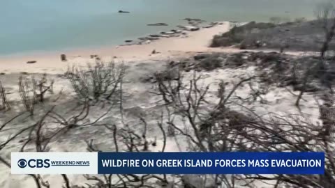 Wildfires burn through Greece's popular vacation island Rhodes