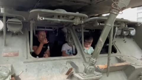 Ukrainian Children pretending they are Russian soldiers in a Russian BUK we .