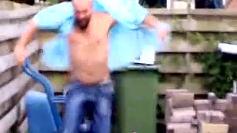 Shirtless Man Blows Up Microwave Using A Firework Outdoors