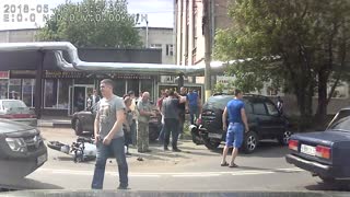 Motorcyclist Flung Under a Car