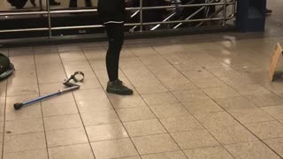 One legged woman dancing in subway station