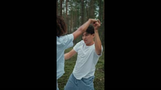 couple dancing in the forest