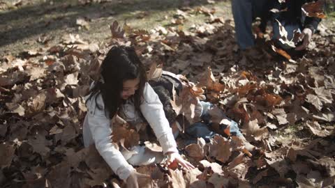 Family Playing a Dry Leaves