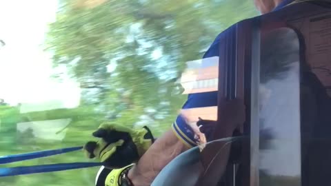 Train conductor driver working out blue resistance band