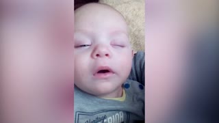 Cute Baby Giggles Himself Awake