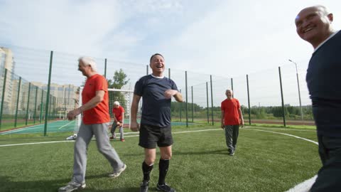 Old people playing football