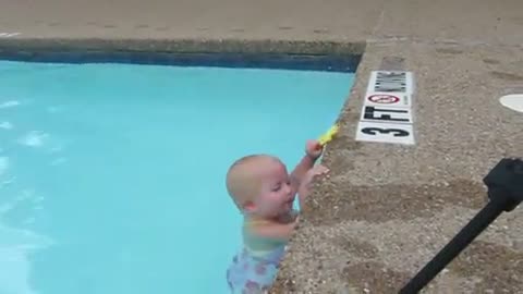 Toddler swims solo in the pool